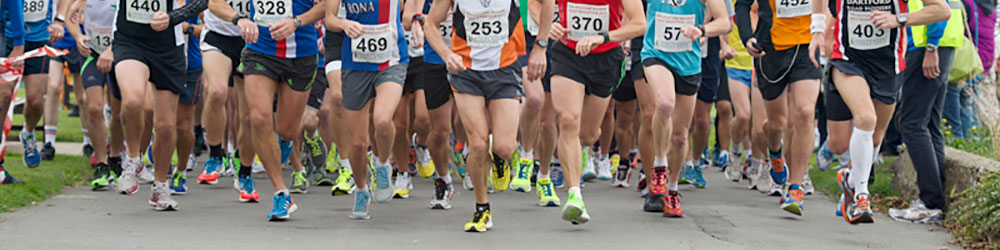 Runners launching off the starting line at the 2013 Half Marathon on The Leas in Folkestone, Kent.