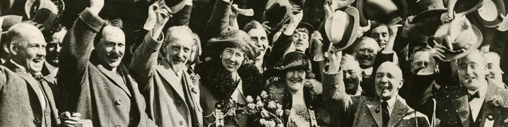 A group of Rotarians, including Stanley Leverton, 1952-53 president of Rotary International in Great Britain and Ireland, and Guy Gundaker, 1923-24 RI president, covered in confetti and streamers at the 1922 Los Angeles convention.