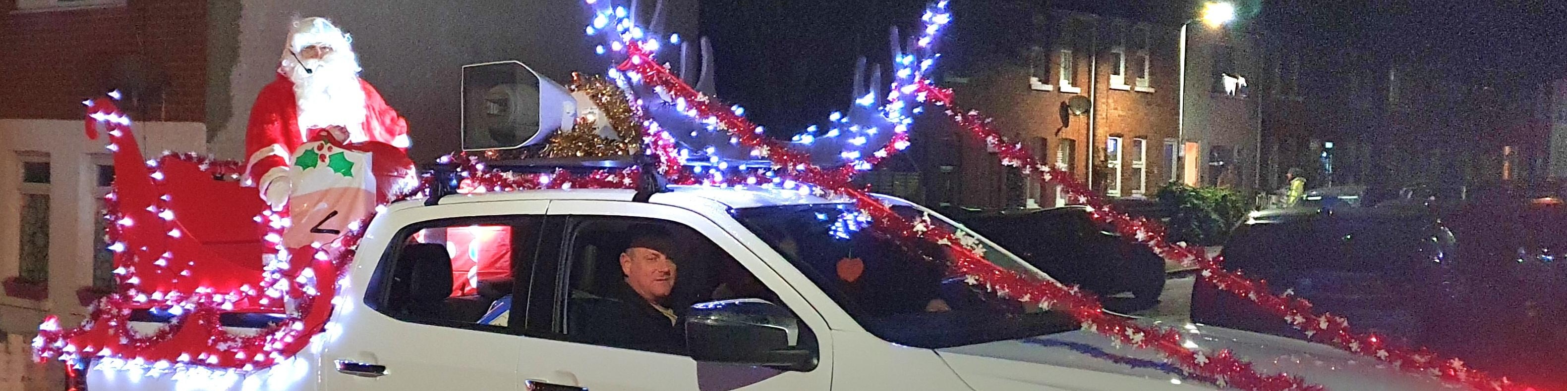 Santa on his 4x4 sleigh, ready to distribute sweets and good cheer in Folkestone